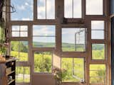 11ft tall reclaimed window wall that was built using original windows from our 19th century farmhouse