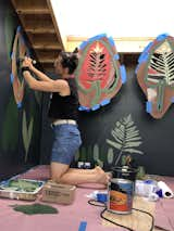 Painting the wallpaper using leaves harvested right outside the cabin and made into stencils  Photo 11 of 11 in Catskills Birdhouse at Bellfire by Mina Teslaru