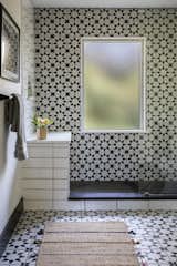 New full bath with walk-in shower (Prior to renovation, this area was a back entrance foyer, and that window used to the back door) 