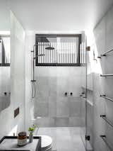 Bath Room, One Piece Toilet, Porcelain Tile Floor, Ceiling Lighting, Stone Counter, Open Shower, Undermount Sink, and Porcelain Tile Wall  Photo 13 of 74 in Alexander - Developed by Adjani by Aaron Hatch