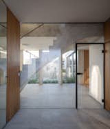 Hallway and Concrete Floor  Photo 6 of 20 in Family House With Atrium by SENAA architekti