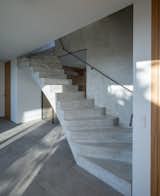 Staircase, Concrete Tread, and Metal Railing  Photo 8 of 20 in Family House With Atrium by SENAA architekti
