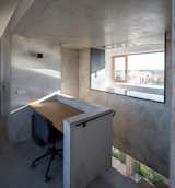 Office, Study Room Type, Chair, Desk, and Cement Tile Floor  Photo 10 of 20 in Family House With Atrium by SENAA architekti