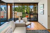 The east-facing entry features a semi-private elevator entrance and a full wall of windows to take in the plentiful morning light.