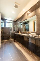 Every bath has wall hung toilets and floating vanities.  This primary suite bath wows everyone who steps in.