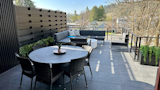 Outdoor living is a premium for Idaho summers.  The third floor entertaining area features an indoor bar with appliances, outdoor BBQ and residential elevator connected it to the lower floors.