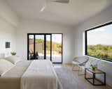 A primary bedroom with views for more than 35 miles and daily sunrises