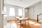 Dining Room, Standard Layout Fireplace, Table, Ceiling Lighting, and Light Hardwood Floor  Photo 7 of 26 in Harlan-Bogan House by Matthew Warner