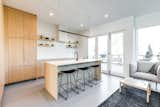 Kitchen, Engineered Quartz Counter, Vinyl Floor, Drop In Sink, Recessed Lighting, Refrigerator, Accent Lighting, and Wood Cabinet  Photo 11 of 26 in Harlan-Bogan House by Matthew Warner