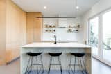 Kitchen, Recessed Lighting, Refrigerator, Cooktops, Engineered Quartz Counter, Drop In Sink, Vinyl Floor, Wood Cabinet, and Accent Lighting  Photo 12 of 26 in Harlan-Bogan House by Matthew Warner