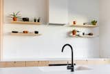 Kitchen, Range Hood, Cooktops, Engineered Quartz Counter, Wood Cabinet, and Undermount Sink  Photo 16 of 26 in Harlan-Bogan House by Matthew Warner