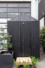 Exterior, Wood Siding Material, and Hipped RoofLine A beautiful New Zealand made outdoor copper shower. Keeping it simple with only cold water as an instant refresh post sauna.  Made by Hideaway’s Saves from The Yakisugi Sauna