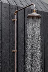 Bespoke antique copper shower, with a hand-spun copper shower head and brass fittings made in New Zealand for longevity. The copper has already begun it's gentle patina, which will only add to the texture and tone of Bernie.