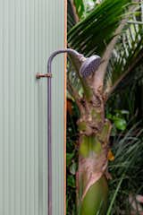 An aged outdoor cold copper shower for those refreshing and revitalising post-sauna showers.
