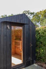 Exterior and Wood Siding Material Aged copper lighting and shower, with an off-set aluminium brow in Colorsteel Ebony  Photo 2 of 8 in Yakisugi Sauna/Yoga Studio by Made by Hideaway