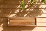 For added interest, the team designed custom plywood window casings. "Usually you try to hide it,  Photo 10 of 13 in A Tiny Off-Grid Cabin in Remote Italy Is as Easy to Take Apart as It Was to Build