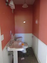 Before: The home’s half bath was taken down to the studs.