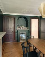 After an update, the dining room dry bar is party ready. The floors and brown woodwork are original. The ceiling and crown molding are painted White Opulence in a flat finish.