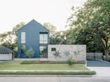 Tile, Texas Stone, and Concrete Rule in This Soaring Houston Home - Photo 1 of 15 - 
