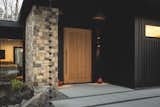Front door - pivot door built with lumber milled from trees on site