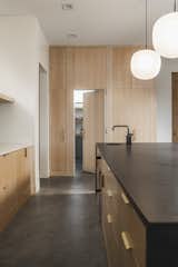 Hidden Pantry door and panel ready refrigerator keeps the minimalist aesthetic intact
