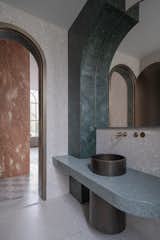 The arch serve  blocks the view from the living space to the powder room door.
