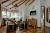 The Star treehouse is five-sided, reminiscent of the shape of a star. There are many natural elements, including a tree root coffee table.