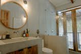 The bathroom has louvres that can be opened up to the outside. 