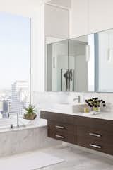 Bath Room, Pendant Lighting, Marble Counter, Ceramic Tile Floor, Vessel Sink, and Drop In Tub A crisp white master bathroom  Photo 12 of 14 in W Penthouse by Jordan Murphy