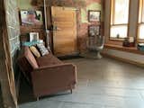 Hallway and Ceramic Tile Floor Entry area, old Freezer door leads out to a large car shop  Photo 7 of 8 in The Butchers Wife by Windy Tevlin