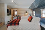 The "lookout loft" has 2 trundle beds and a queen bed in an open area upstairs. 