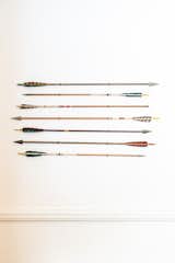 Wall art of old arrows found in the barn. 