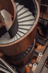 The winding stairs are made of steel construction and covered with walnut veneer.