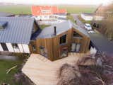 The addition has Larch siding and deck, core-ten pop-out window seat, Plannja click standing seam roof and German windows and doors.