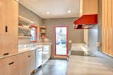 Kitchen, Laminate Counter, Accent Lighting, Range, Refrigerator, Dishwasher, Range Hood, Vinyl Floor, Wood Cabinet, Vessel Sink, and Recessed Lighting Felicity House Main House Kitchen  Photo 8 of 13 in Felicity House by Nicole Kimberling
