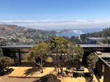 Exterior, Gable RoofLine, Wood Siding Material, Metal Roof Material, and Beach House Building Type Top view of the house and the Zapallar bay  Photo 1 of 8 in Cerro la Higuera House by Rodrigo De la Cerda