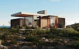The house’s functional program is distributed as follows: the living room and the dining room are concentrated in a larger volume; the bedroom and the bathroom are in a smaller volume. The garage for two vehicles is located on the site, near the house. Its structure is a concrete slab with a canopy.