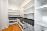 Walk-in pantry with granite counters, drawers and coffee/ smoothie station and sink. 