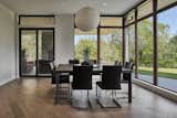 The dining room features expansive views of the outdoors.