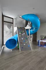The slide and climbing wall connect the upstairs and downstairs play rooms.