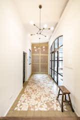 Hallway and Ceramic Tile Floor Entrance with view in the living room  Photo 9 of 10 in Loft in former Garage by studio karhard