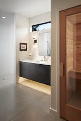 Bath Room, Concrete Wall, Open Shower, Concrete Floor, and Recessed Lighting Peak into sauna and bathroom.  Photo 4 of 6 in The Liv House by Pearl Schaar