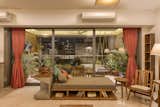 One end of the Living space opens up to the balcony by a series of sliding doors. A modern version of "Diwan" along with a reading nook forms the main connection between the inside and outside.