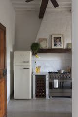 Kitchen. Smeg fridge and cooker
Targetti clamp lamp 70's 
Tailor's table 19th century
