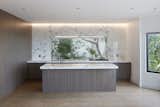 backsplash cutout becomes the island top, arabascato marble continues the branches beyond