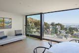 3 stacking aluminum framed sliding glass doors for the seamless 25'W balcony deck