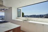 view of Corona Heights wraps around the house through the 13' long backsplash window