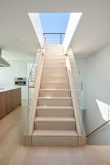 stairway wrapped in white washed oak wood