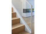Staircase, Glass Railing, and Wood Tread handrail and guardrail details  Photo 17 of 23 in House on Flint by Alan Tse