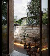Outdoor, Back Yard, Small Patio, Porch, Deck, Landscape Lighting, Stone Fences, Wall, and Trees  Photo 11 of 11 in Sacré coeur, Stone House by Theo Domini